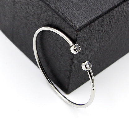 Złota otwarta bransoletka z bliźniaczymi kryształami