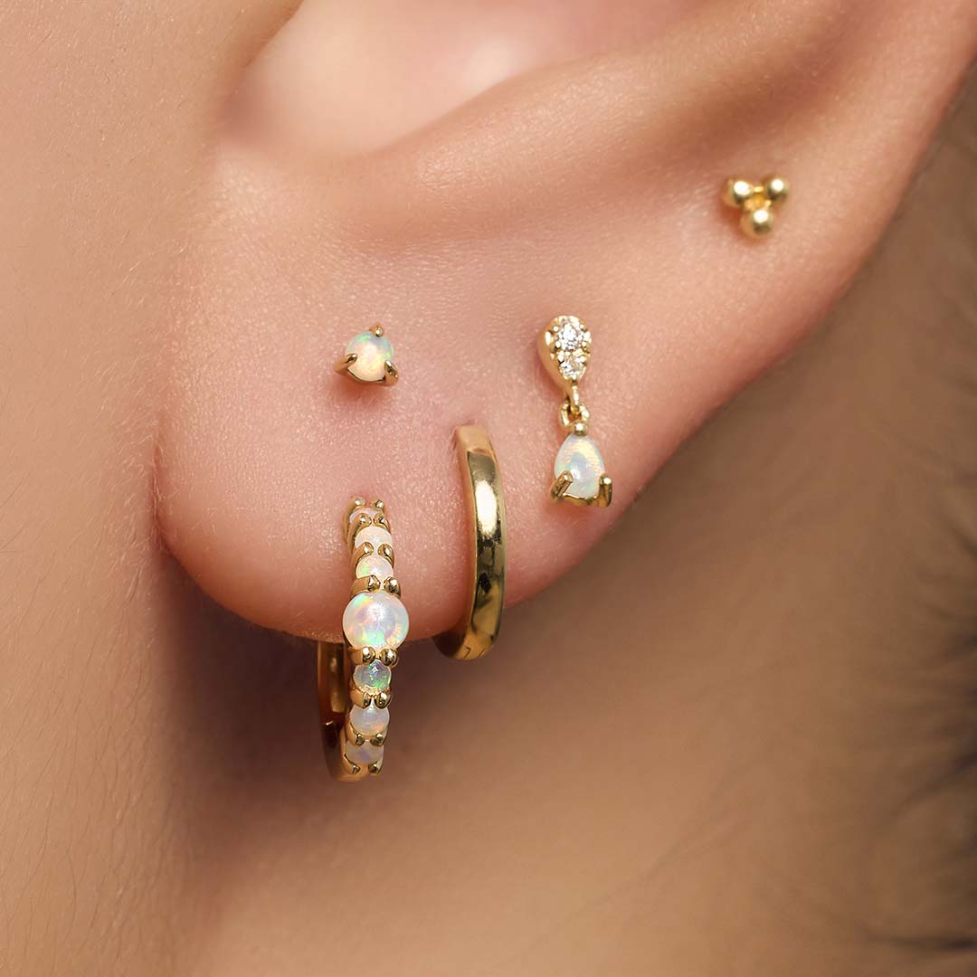 Piercing z opalem i diamentem