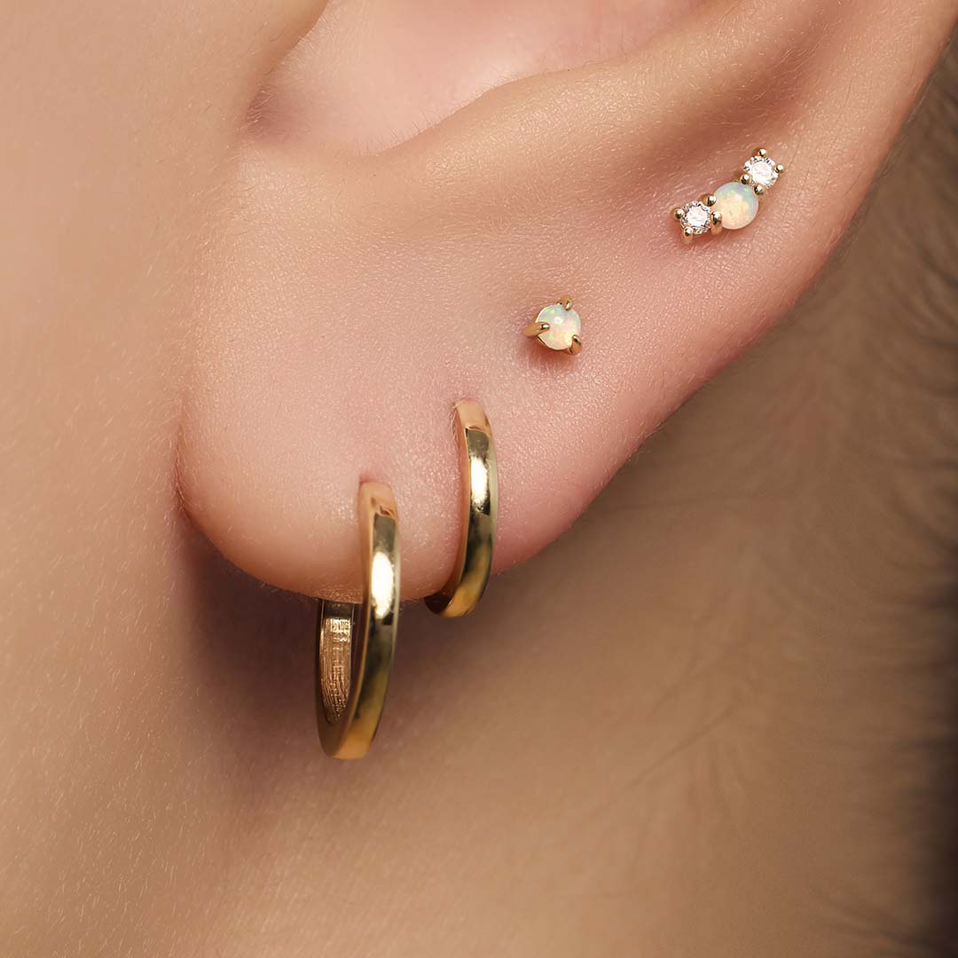 Opal i diamentowy piercing
