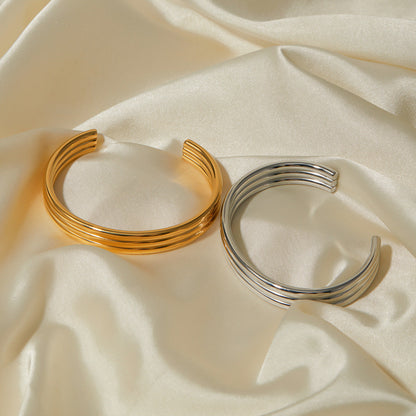 Złota spiralna bransoletka damska Odette elegancka