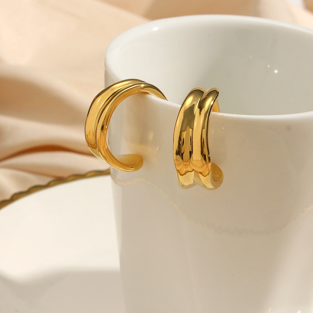 Eleganckie kolczyki faliste złote 18k