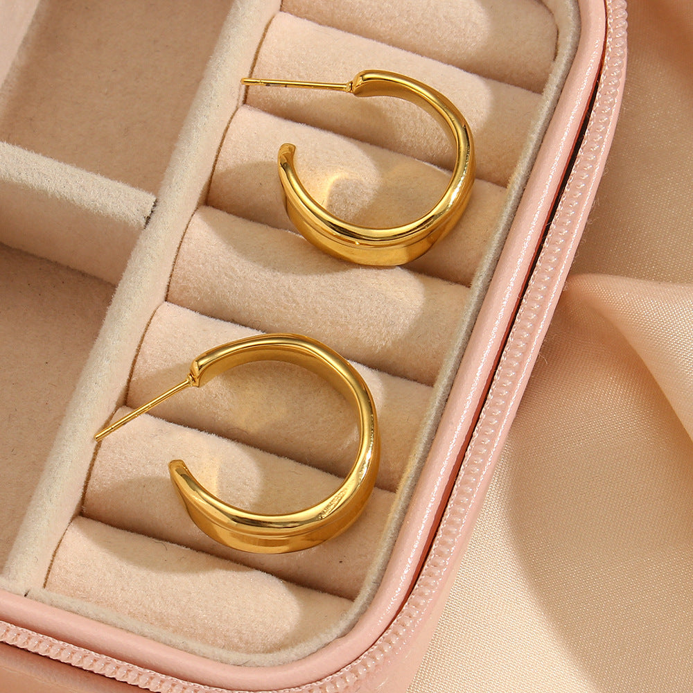 Eleganckie kolczyki faliste złote 18k